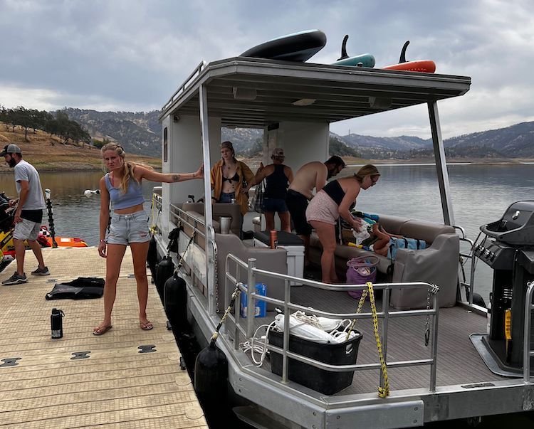 Group on pontoon boat, getting ready to go out on the water.
